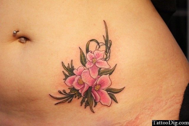 Pink Ink Flowers Tattoo Design For Belly