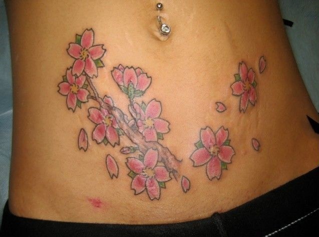 Pink Ink Flowers Tattoo On After Pregnancy Belly