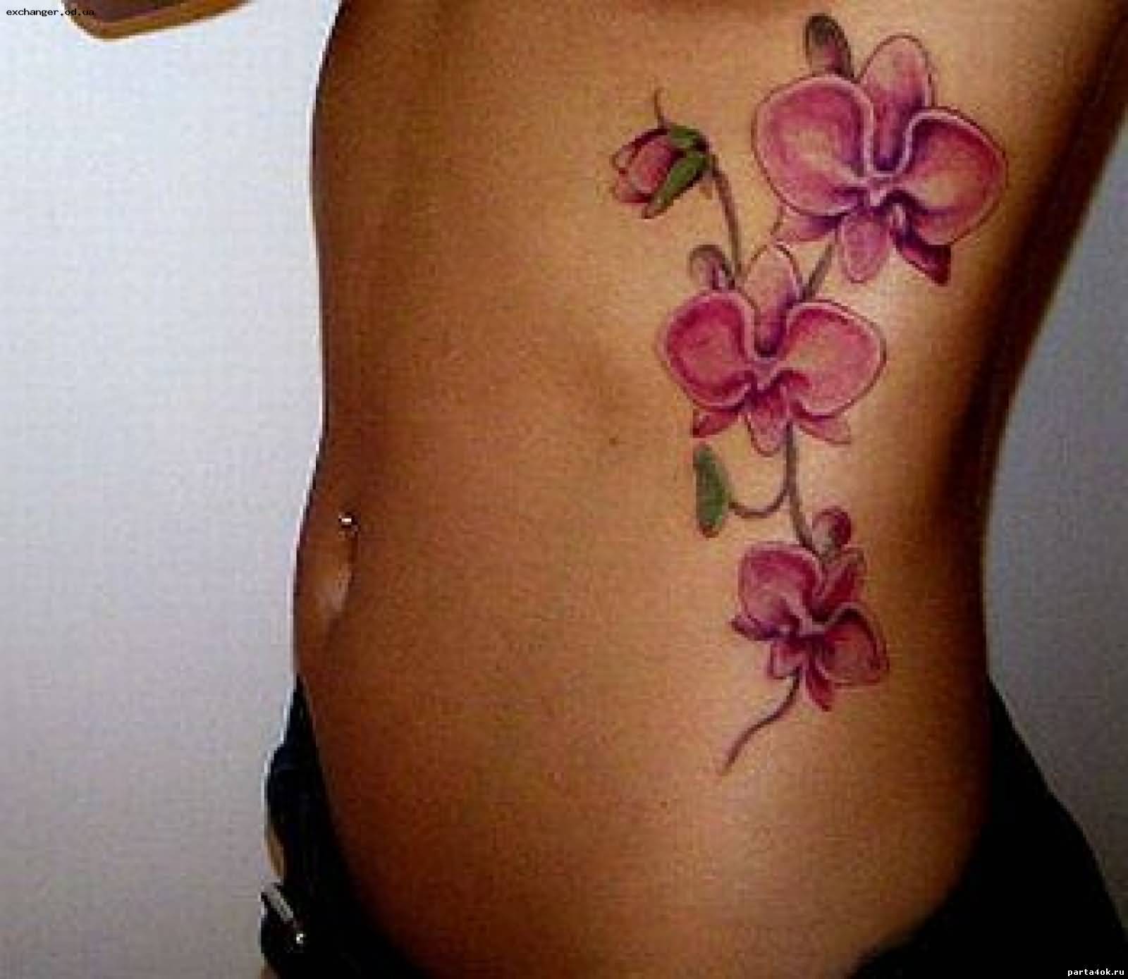 Pink Ink Flowers Tattoo On Side Belly