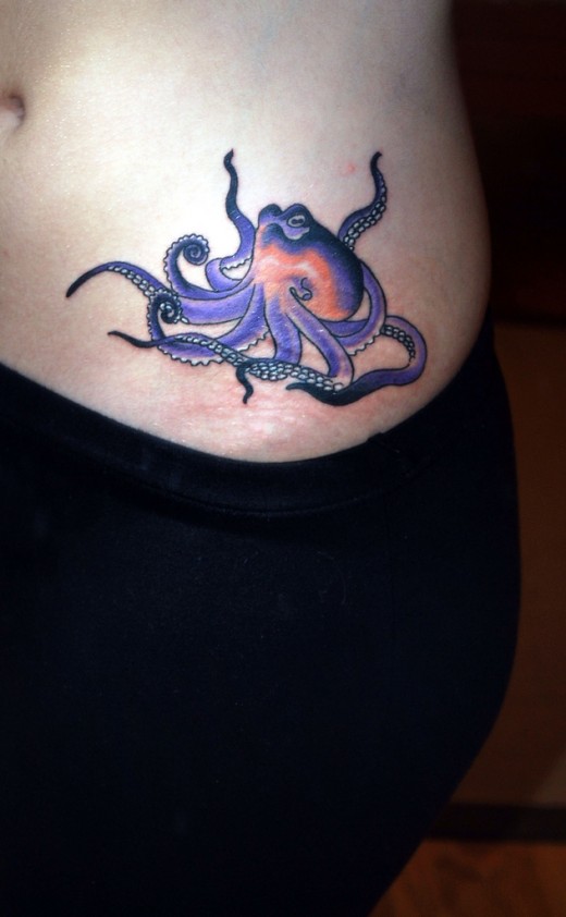 Purple Ink Cute Octopus Tattoo On Side Rib