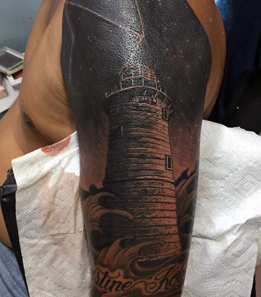 Realistic Lighthouse Tattoo On Guy Left Sleeve