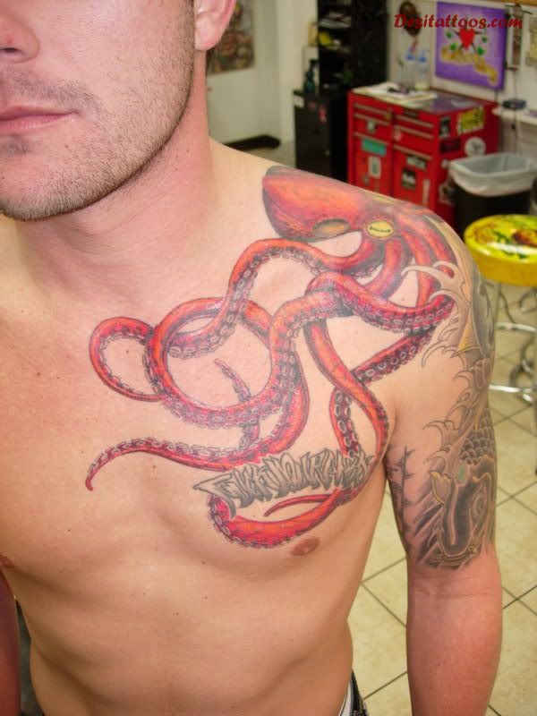 Red Octopus Tattoo On Man Left Shoulder