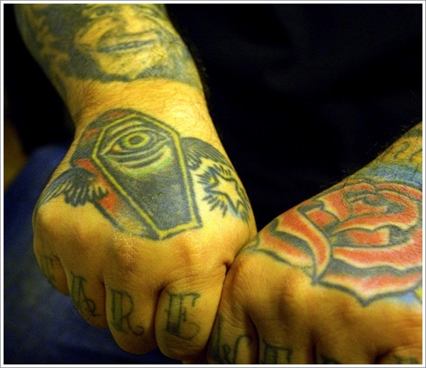 Red Rose And Winged Coffin Tattoos On Hands
