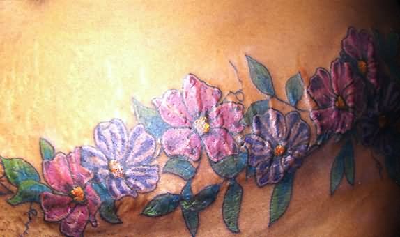 Simple Colorful Flowers Tattoo On After Pregnancy Belly