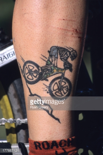 Skeleton Riding Bike Tattoo On Leg Calf