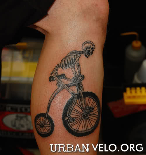 Skeleton Riding Penny Farthing Bike Tattoo On Leg Calf