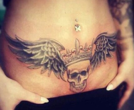 Skull With Wings Tattoo On After Pregnancy Belly