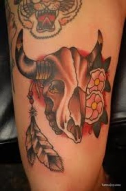Traditional Cow Skull With Feathers And Flowers Tattoo Design