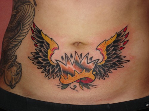Traditional Crown With Wings Tattoo On Belly