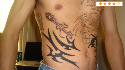 Tribal Design With Key Tattoo On Man Side Belly