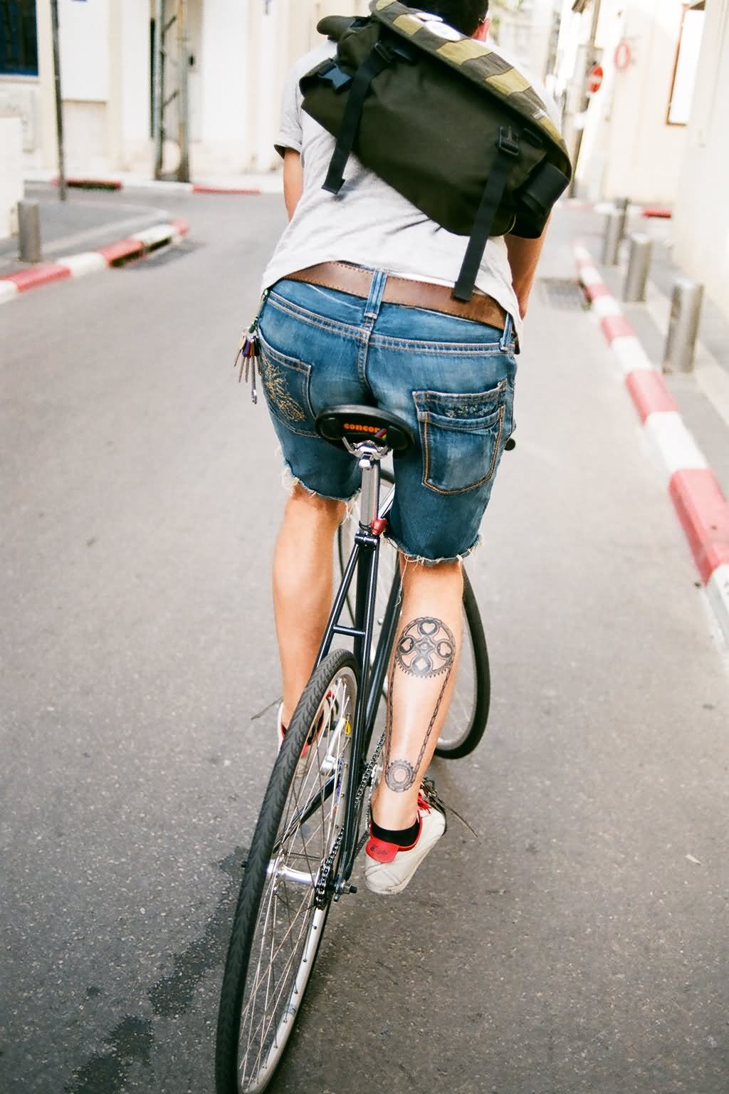 Two Bike Gears With Chain Tattoo On Right Leg