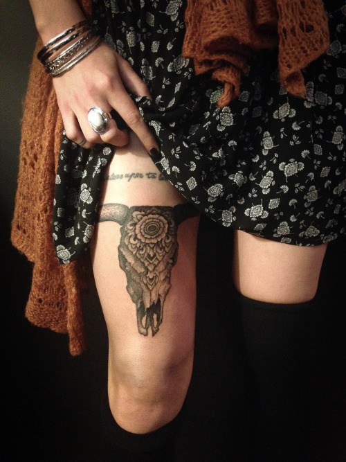 Unique Black Ink Cow Skull Tattoo On Girl Thigh