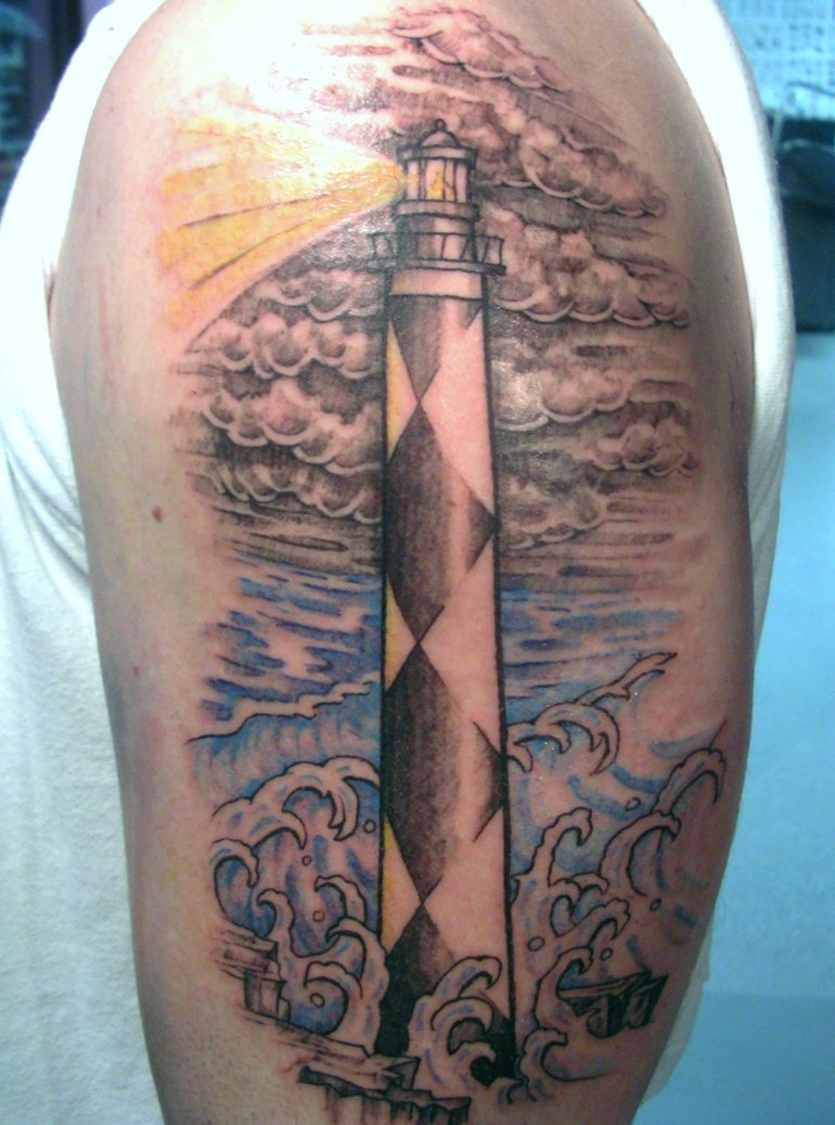 Water Waves And Lighthouse Tattoo On Man Left Half Sleeve