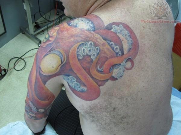 Yellow Eyes Octopus Tattoo On Man Left Shoulder