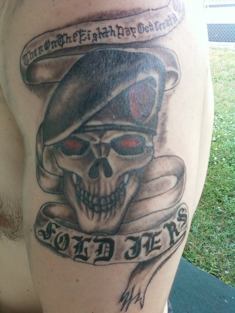 Army Skull With Banner Tattoo On Man Left Half Shoulder