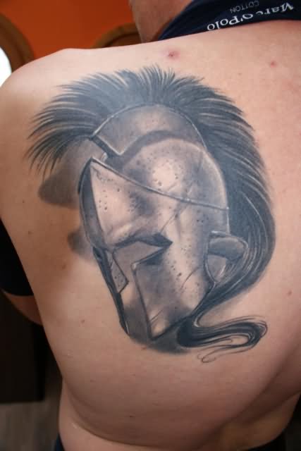 Black And Grey 3D Warrior Helmet Tattoo On Left Back Shoulder