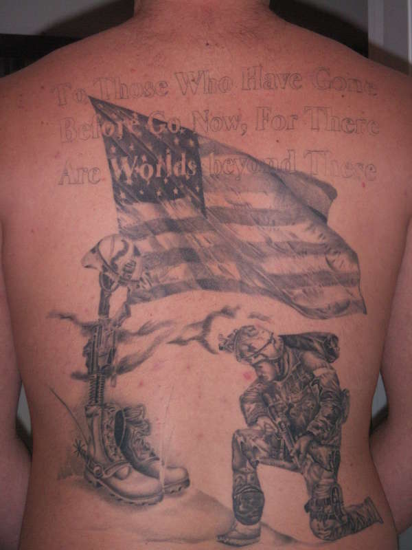 Black And Grey Army Equipment And Flag Tattoo On Man Full Back