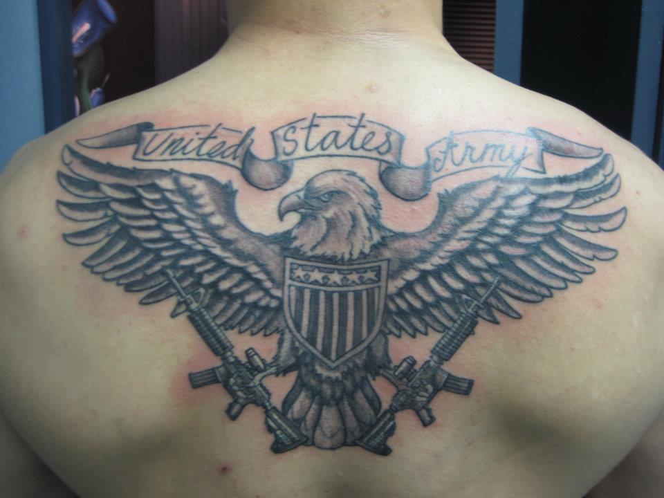 Black And Grey Army Symbol Tattoo On Man Upper Back