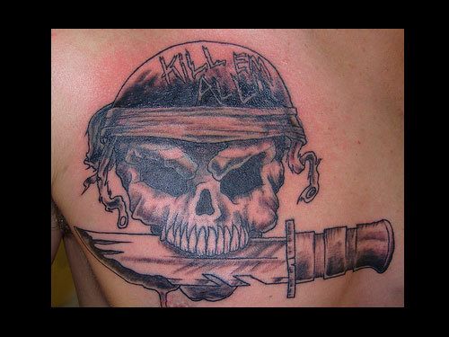 Black Ink Army Skull Holding Dagger In Teeth Tattoo On Man Chest