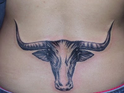 Black Ink Cow Head Tattoo Design For Lower Back