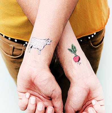 Cow And Radish Tattoo On Both Wrist