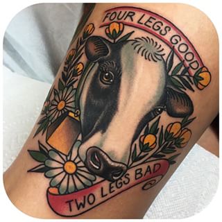 Cow Head With Banner And Flowers Tattoo Design