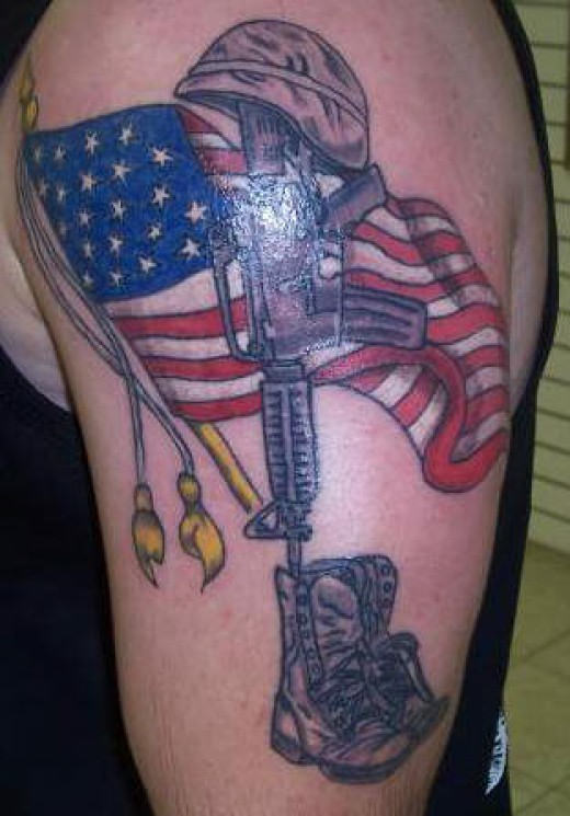 Memorial Army Equipment With Flag Tattoo On Left Shoulder