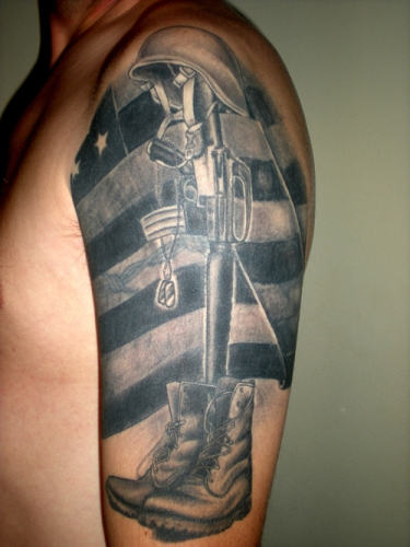 Memorial Army Equipment With Flag Tattoo On Man Left Half Sleeve