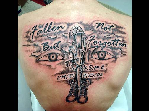 Memorial Army Equipments And Two Eyes Tattoo On Man Upper Back