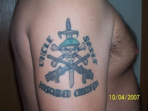 Sword In Army Skull And Two Crossing Guns Tattoo On Right Shoulder