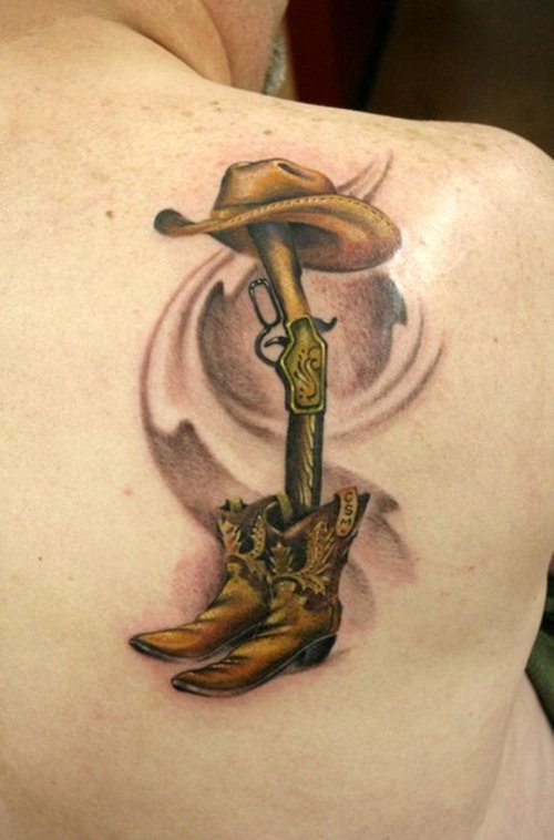 3D Cowboy Hat With Gun And Shoe Tattoo On Right Back Shoulder