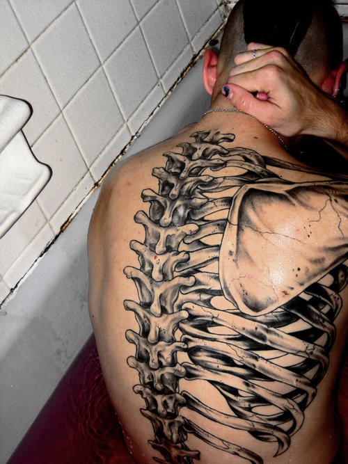 3D Rib Cage Bone Tattoo On Man Back