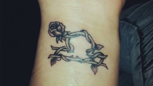 Amazing Grey Ink Rose Flower And Libra Zodiac Tattoo On Wrist