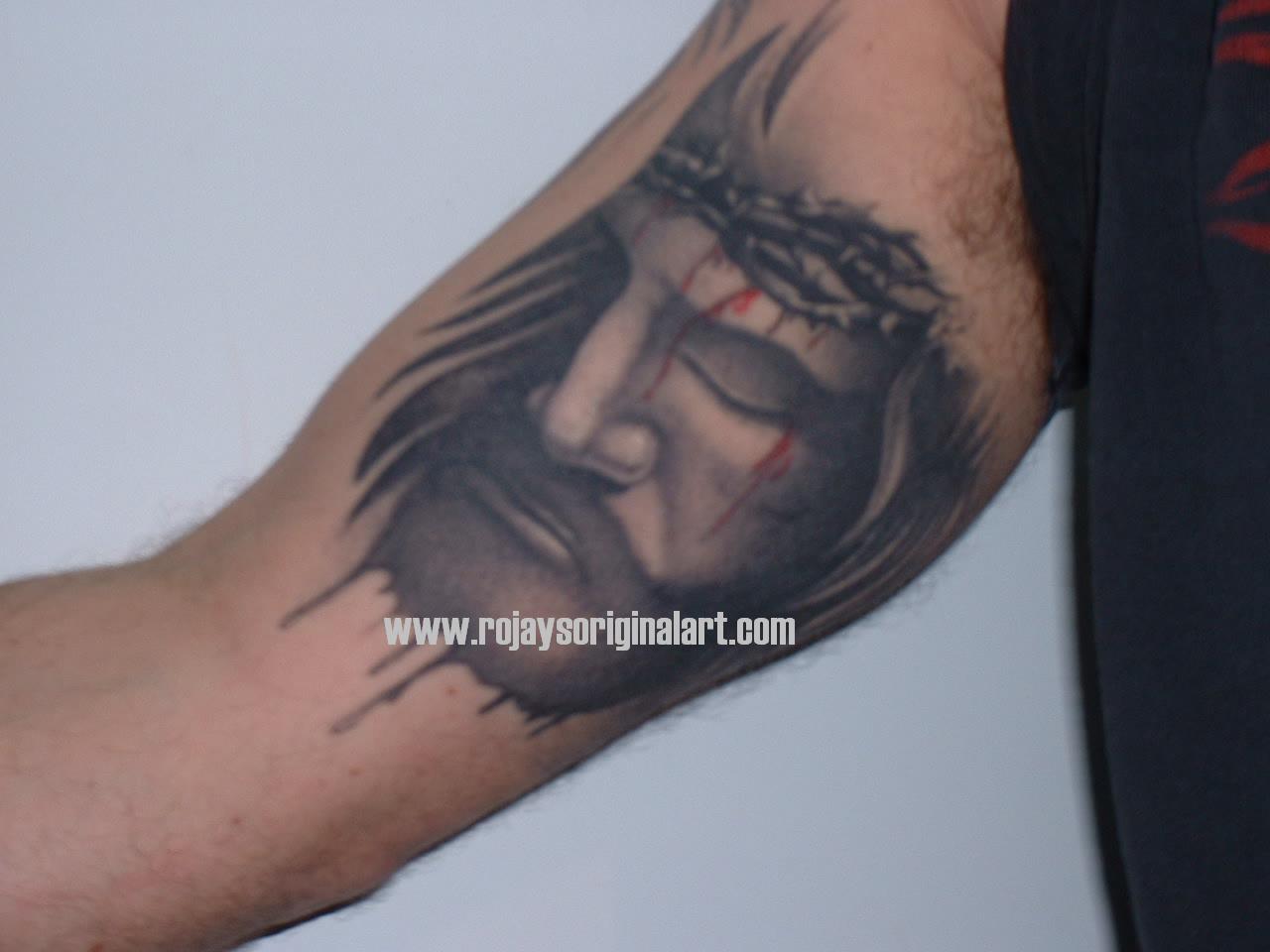 Black And Grey Christian Jesus Face Tattoo On Half Sleeve