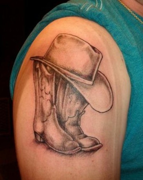 Black And Grey Cowboy Hat With Shoe Tattoo On Right Shoulder