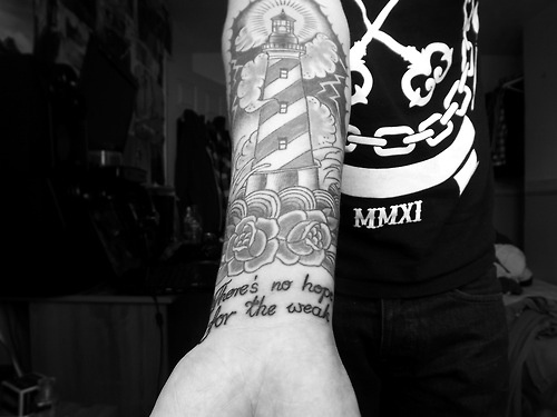 Black And Grey Lighthouse Tattoo On Man Right Forearm