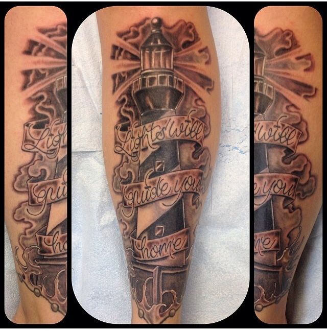 Black And Grey Lighthouse With Banner Tattoo On Leg