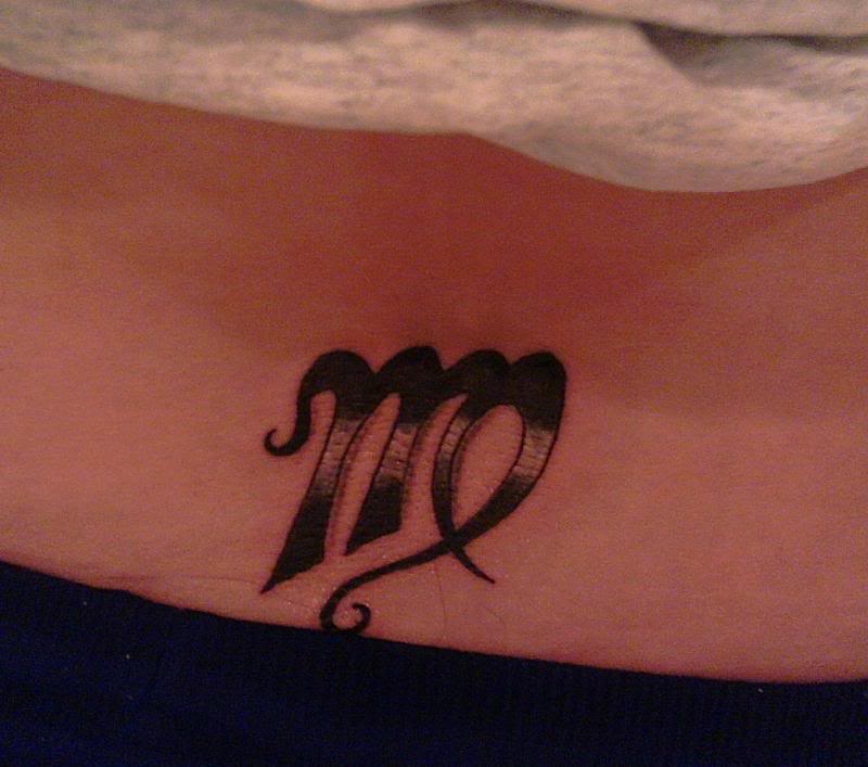 Black And Grey Virgo Zodiac Sign Tattoo On Lower Back