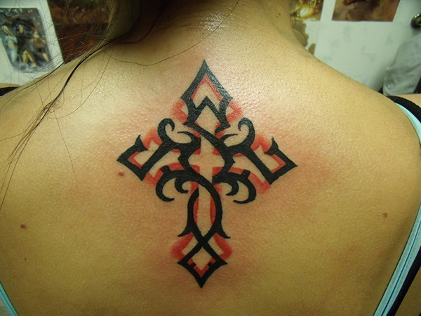 Black And Red Tribal Christian Cross Tattoo On Girl Upper Back