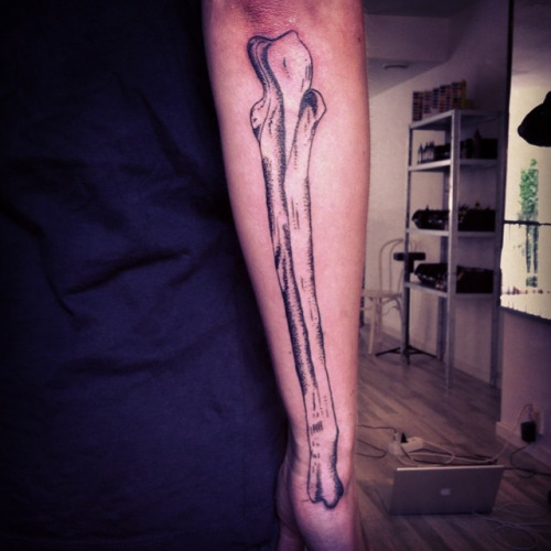Black Bone Tattoo On Forearm