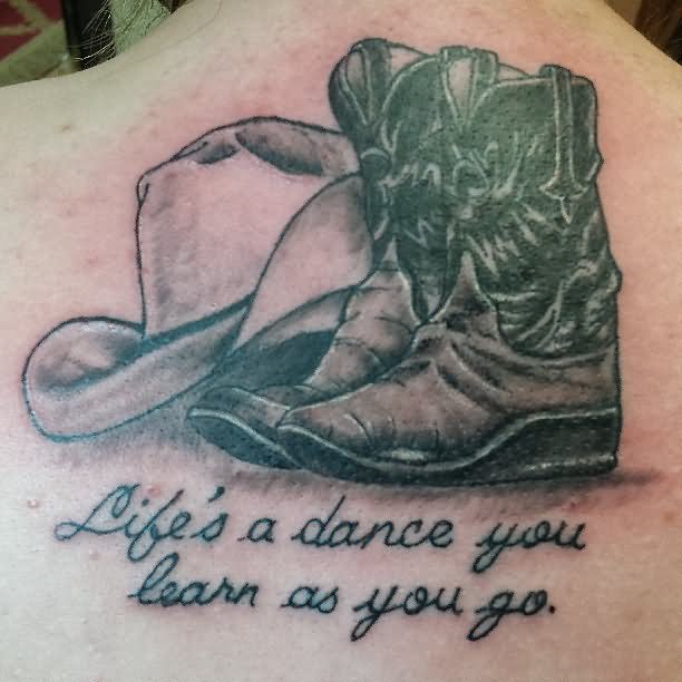 Black Ink Cowboy Shoes With Hat Tattoo On Man Upper Back