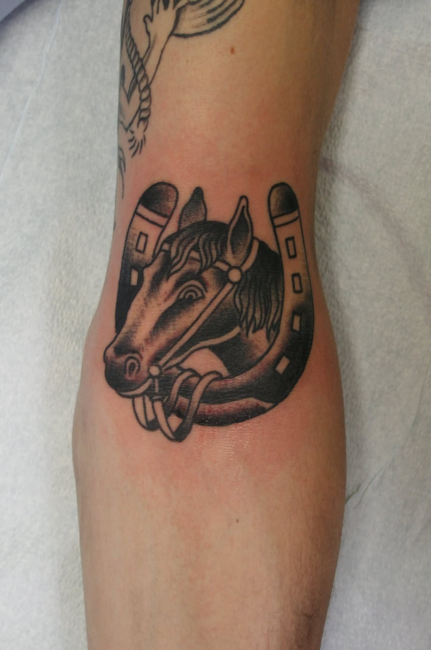 Black Ink Cowboy Horse Head In Horseshoe Tattoo Design