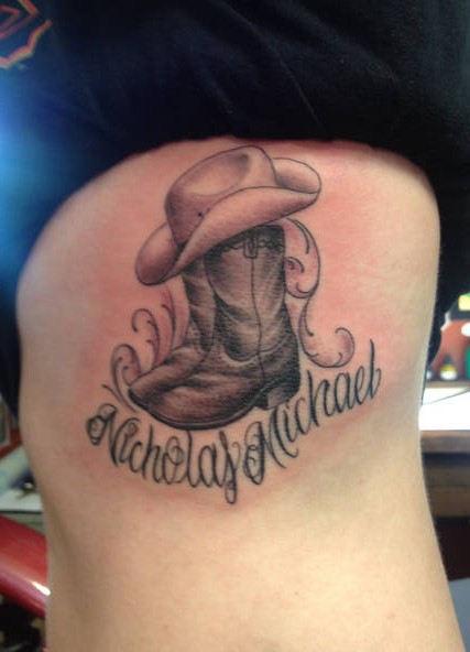 Black Ink Cowboy Shoe With Hat Tattoo Design For Side Rib