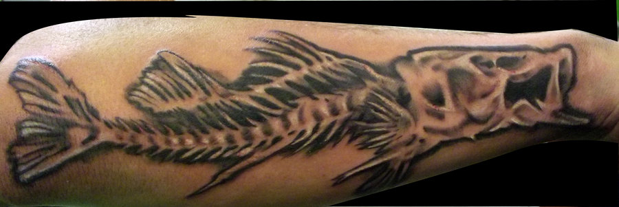 Black Ink Fish Bone Tattoo On Forearm