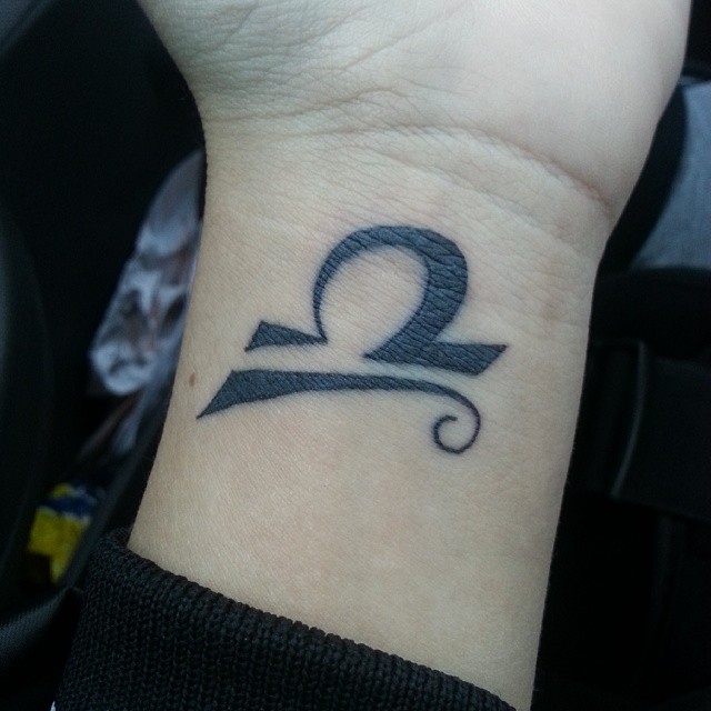 Black Ink Libra Zodiac Symbol Tattoos On Wrists