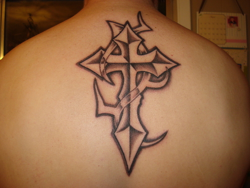 Black Ink Tribal Christian Cross Tattoo On Man Upper Back