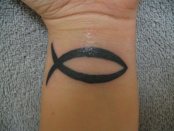 Black Jesus Fish Tattoo On Wrist