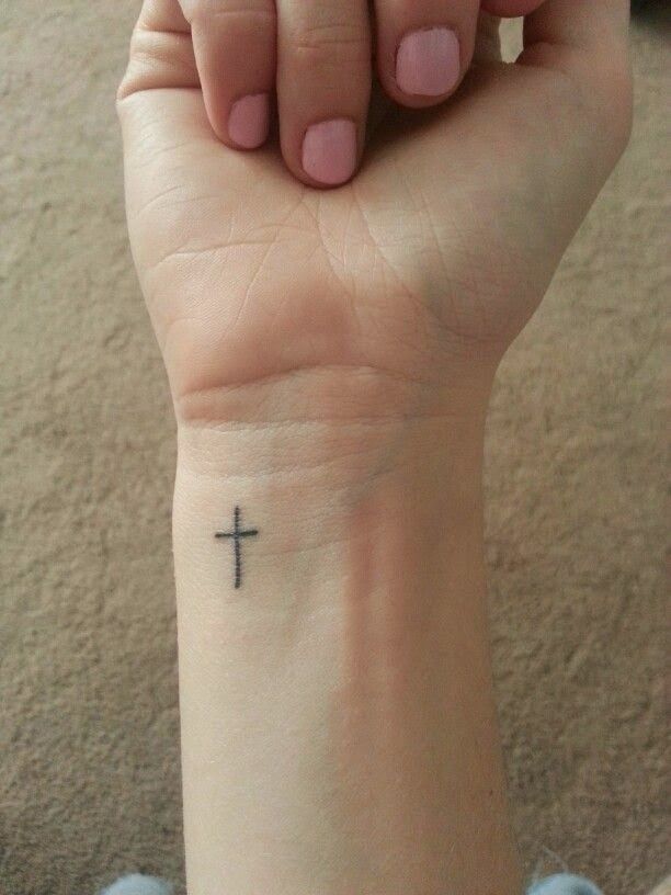 Black Little Christian Cross Tattoo On Wrist