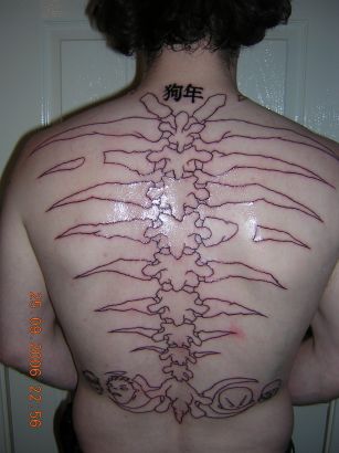Black Outline Spine Bone Tattoo On Full Back