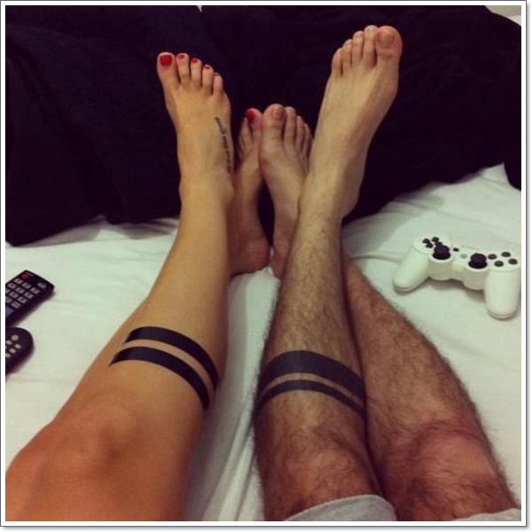 Black Solid  Band Tattoo On Couple Leg
